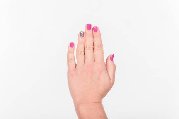 istock Woman Hand with Polish Fingers on White Background. 1497277629