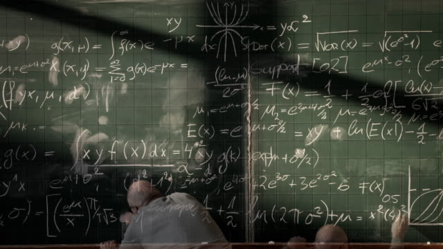 Professor writing on blackboard (timelapse)