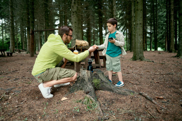 istock Loving father and son bonding in the nature 1497289259