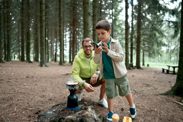 istock Little boy taking pictures in the nature 1497289521