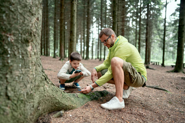 istock Casually dressed family exploring the nature 1497289611