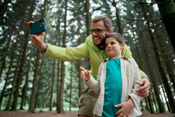 istock Smiling father and son taking a selfie picture 1497289624