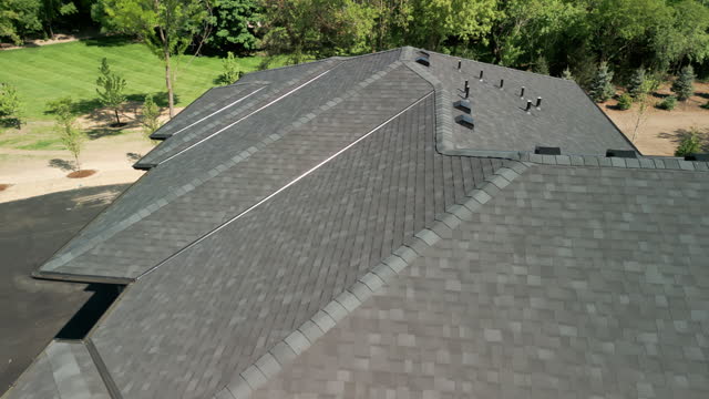 Wide aerial drone shot footage of new Roof at sunny day.