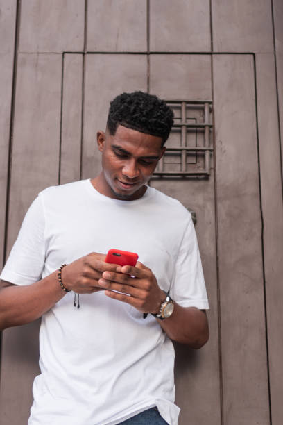 istock African-American man checking his cell phone in the open air 1497297121