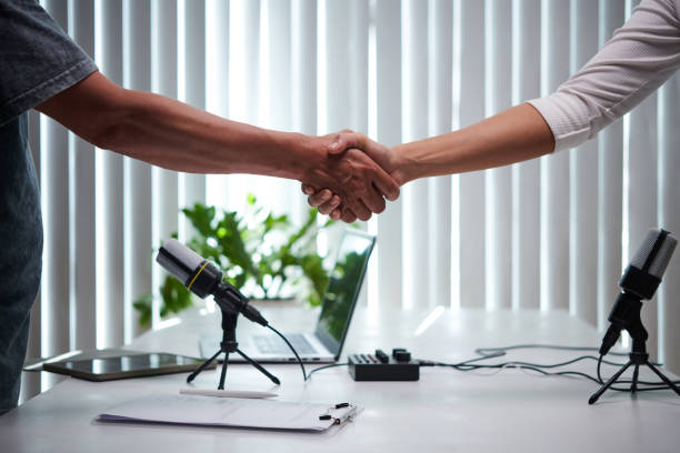 istock Podcaster and Guest Shaking Hands 1497298453