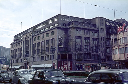 Berlin (West), Germany, 1964. The famous department store KaDeWe in Berlin's Westcity. Also: pedestrians and parked vehicles.