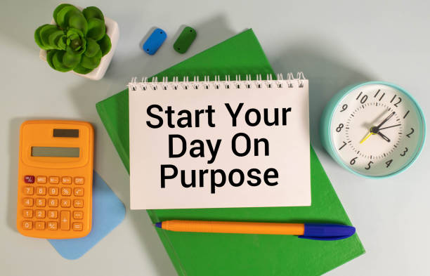 Start Your Day On Purpose text on notepad, concept background stock photo