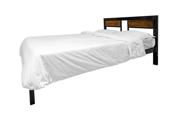 istock Simplistic steel bed with white bedding isolated on white backgrounds 1497301424