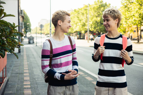 istock Young happy sisters are having fun outside 1497302427