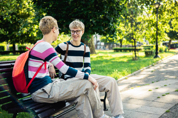 istock Young happy sisters are having fun outside 1497302492