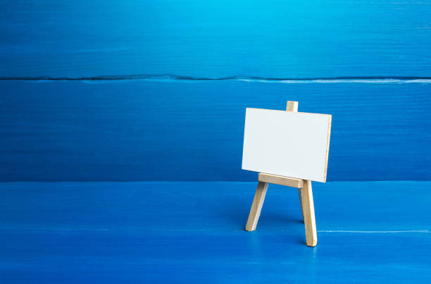 An easel with a white board on a blue background.