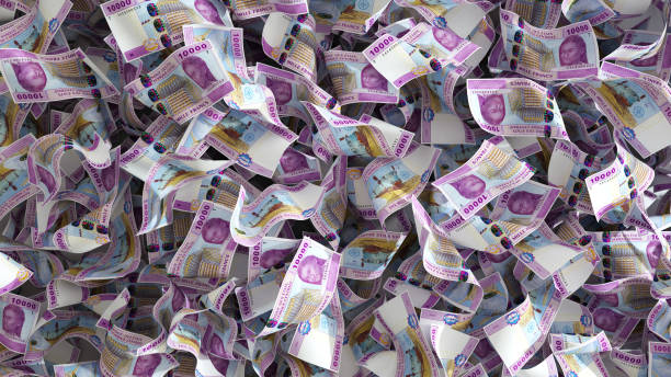 istock 3D rendering of lots of 10000 Central African cfa franc notes spread on surface. money background 1497303895