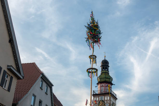 colorful maypole in historical city stock photo