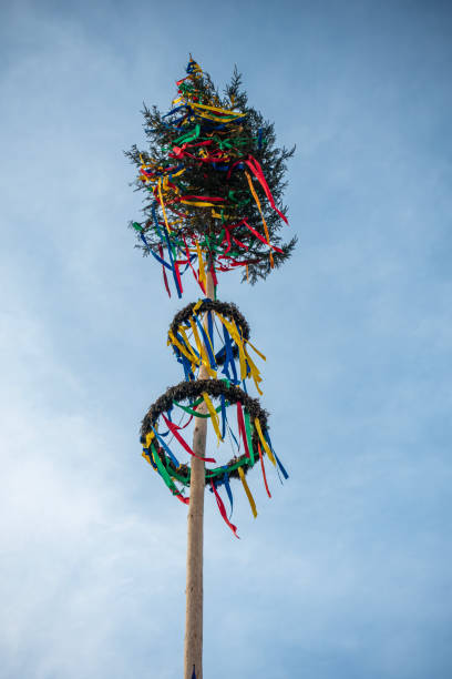 colorful maypole in historical city stock photo