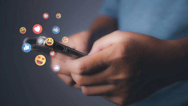 istock man using phone with social media to click like and love icon on internet post. 1497314233