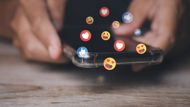 istock man using phone with social media to click like and love icon on internet post. 1497314257