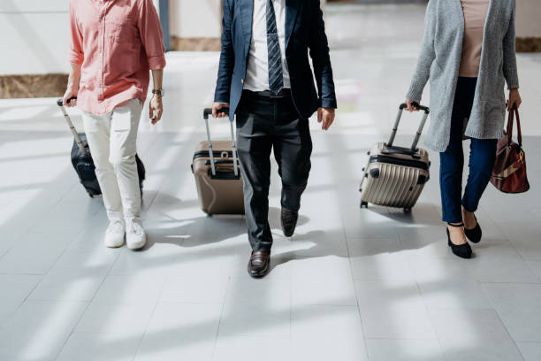 istock Business people walking with luggages 1497314412