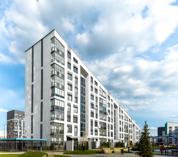 istock Modern residential architecture. Urban multi-storey building, house with gable roof 1497318435