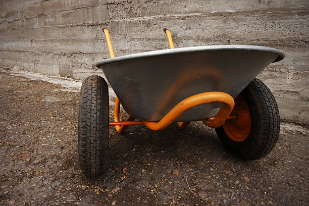 istock orange farmer's two wheelbarrow 149732923