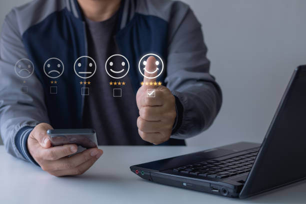 Customer service and Satisfaction concept. Men showing raised thumbs as a gesture of recommendation or a good choice for select smile face icon for client evaluation and customer service satisfaction.