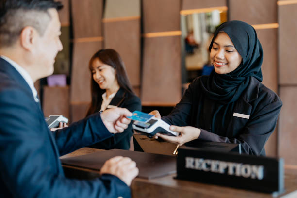 Credit card contactless payment at hotel reception