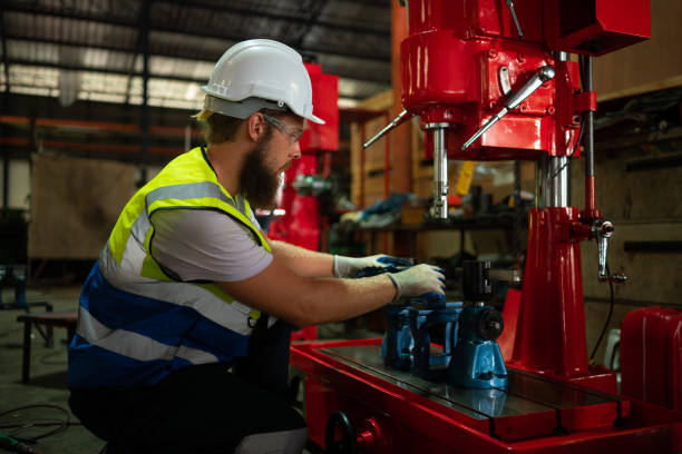 istock Mechanical engineers are checking the working condition of the new machine after completing the installation 1497330712