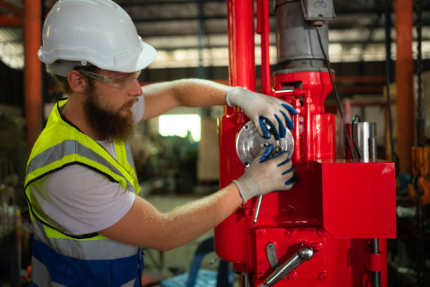 istock Mechanical engineers are checking the working condition of the new machine after completing the installation 1497330714