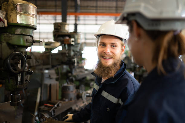 istock Both of mechanical engineers are checking the working condition of an old machine that has been used for some time. In a factory where natural light shines onto the workplace 1497331147