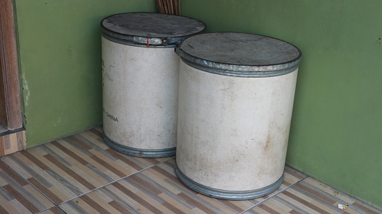 two used barrels by the wall