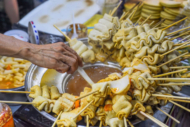 istock Hand adding water in bouillion for Korean fish cakes 1497333164