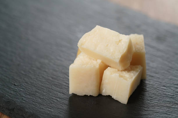 istock pieces of hard parmesan cheese on slate board 1497333182