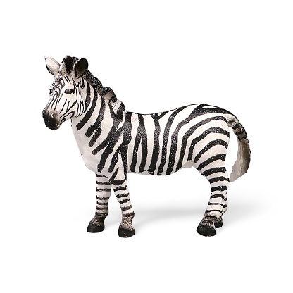 Close-up of a miniature toy zebra animal side view against a white background