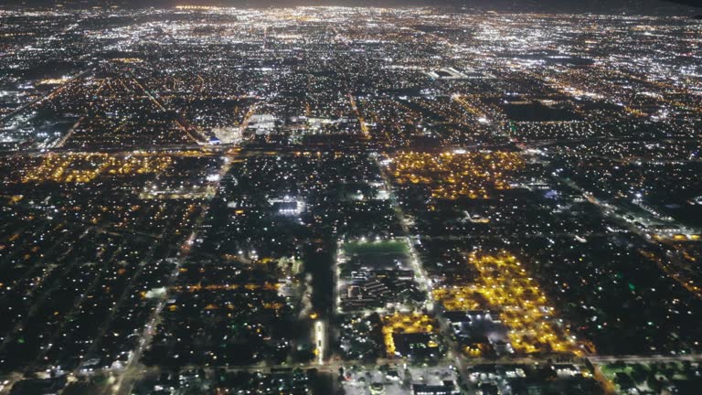 4K night video of Los Angeles city lights from a window of an airplane