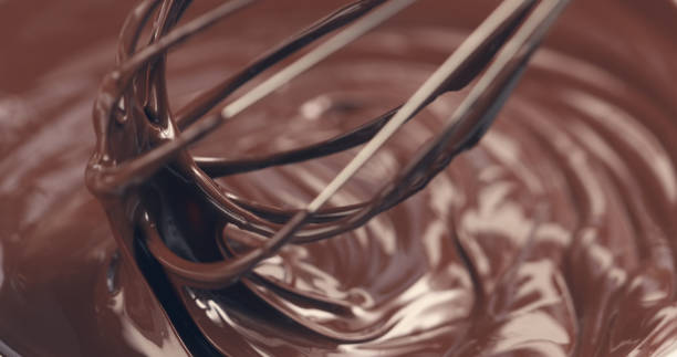 istock mixing melted premium dark chocolate with a whisk toned 1497334727