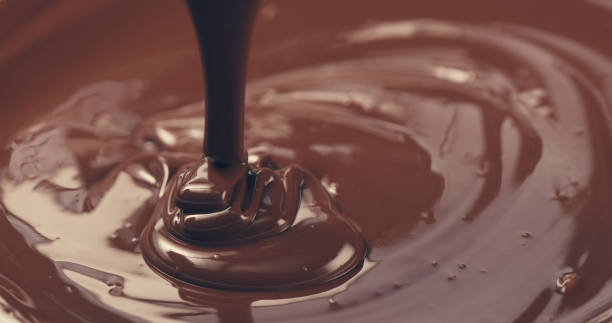 istock premium dark melted chocolate being poured from spoon closeup toned 1497335387