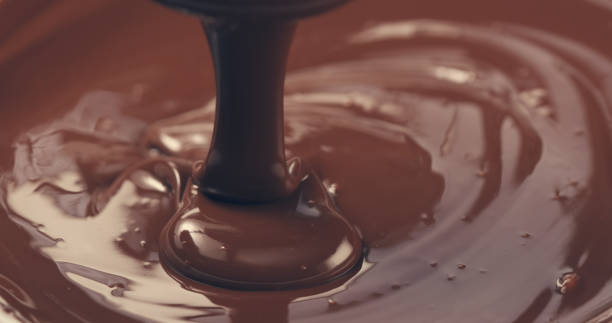 istock premium dark melted chocolate being poured from spoon closeup toned 1497335404