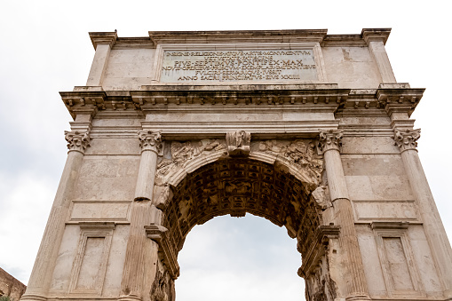 Triumphal Arch of Constantine near Colosseum in the city of Rome, Lazio, Italy, Europe. Arch of Titus in Roman Forum. Beautiful travel destination picture. Cityscape, concept tourism, architecture