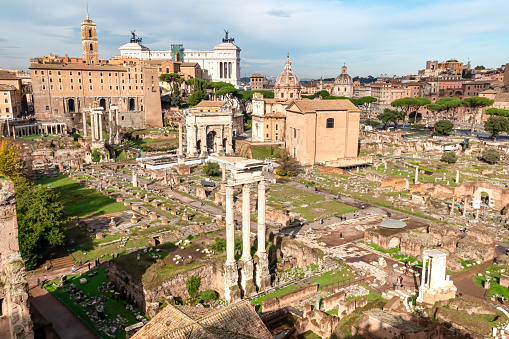 Panoramic view on ancient ruins of Roman Forum and Rome Skyline from Palatine Hill in city of Rome, Lazio, Italy, Europe, EU. Looking on Antoninus and Faustina Temple, Victor Emmanuel II monument