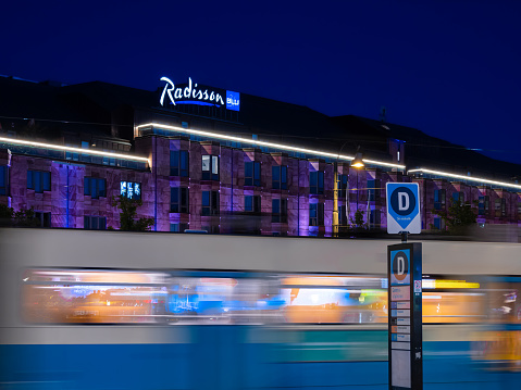 Gothenburg, Sweden - May 30, 2023: A tram in motion by the Radisson Blu Hotel in Gothenburg