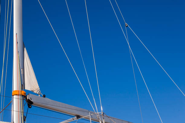 istock The mast of a sailing yacht, with stretched ropes, without sails. 1497345672