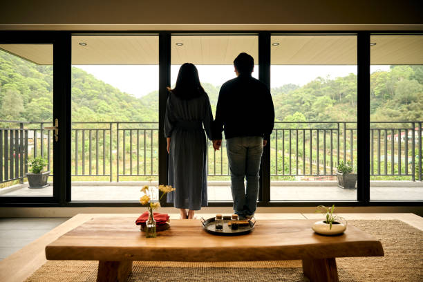 istock Young Asia couple visit tea garden. 1497346119