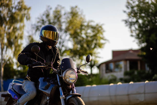 istock motorcyclist in gear and a helmet with a sun visor on a motorcycle in summer 1497347325