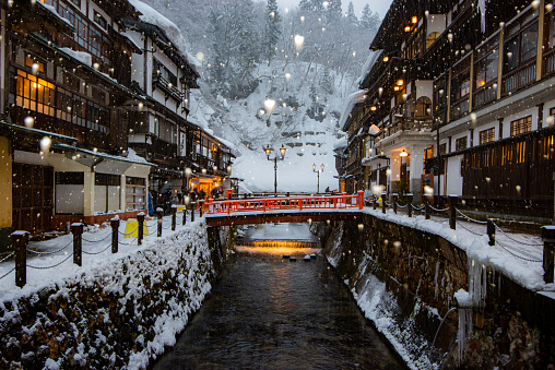 Japan - January 30, 2022 : Scenic view of Old Hot Spiring Accomodation in Winter with Illumination in the evening, Ginzan Onsen is most famous Hot Spring in Yamagata, Japan