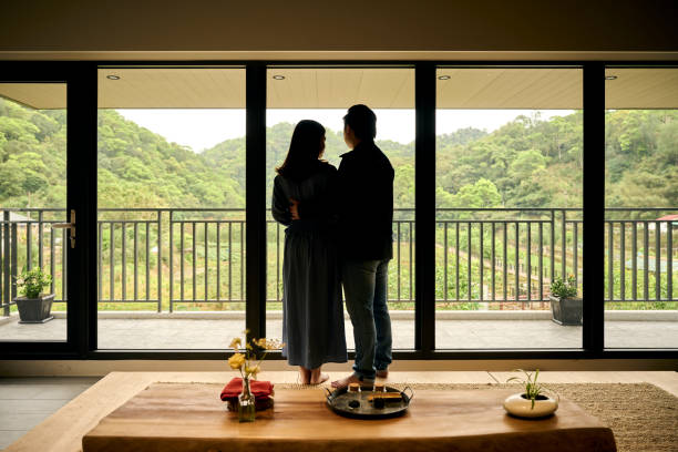 istock Young Asia couple visit tea garden. 1497348721