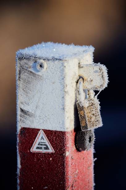 istock a red object with some frost around it and snow covering the corner 1497352180