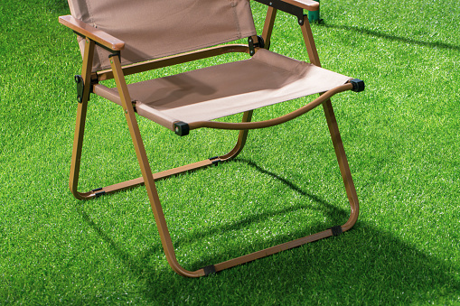 A deckchair on the lawn in the home garden