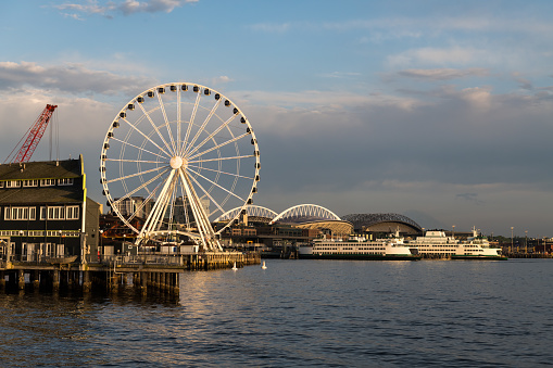 Seattle, USA - May 2, 2023: Late in the day the waterfront from pier 62 just before sunset.