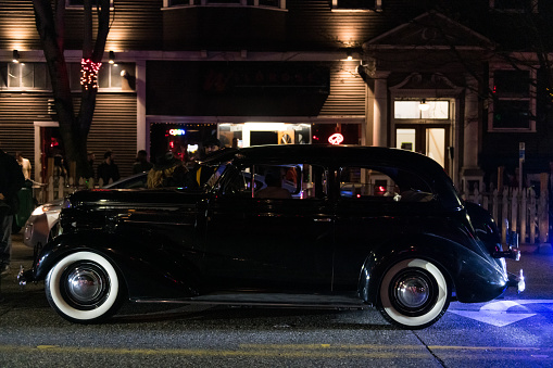 Seattle, USA - May 6th, 2023: A Low Rider car club on Pike Street on Capitol Hill late in the evening.