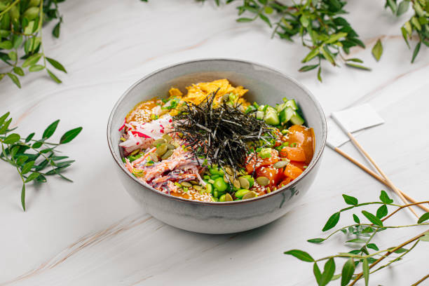 istock Portion of salmon poke bowl with vegetables 1497353645