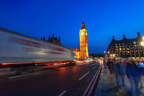 London, England - August 18, 2016: London Big Ben and Westminster Bridge with Palace of Westminster. Blurry people because of Long Exposure. England, UK